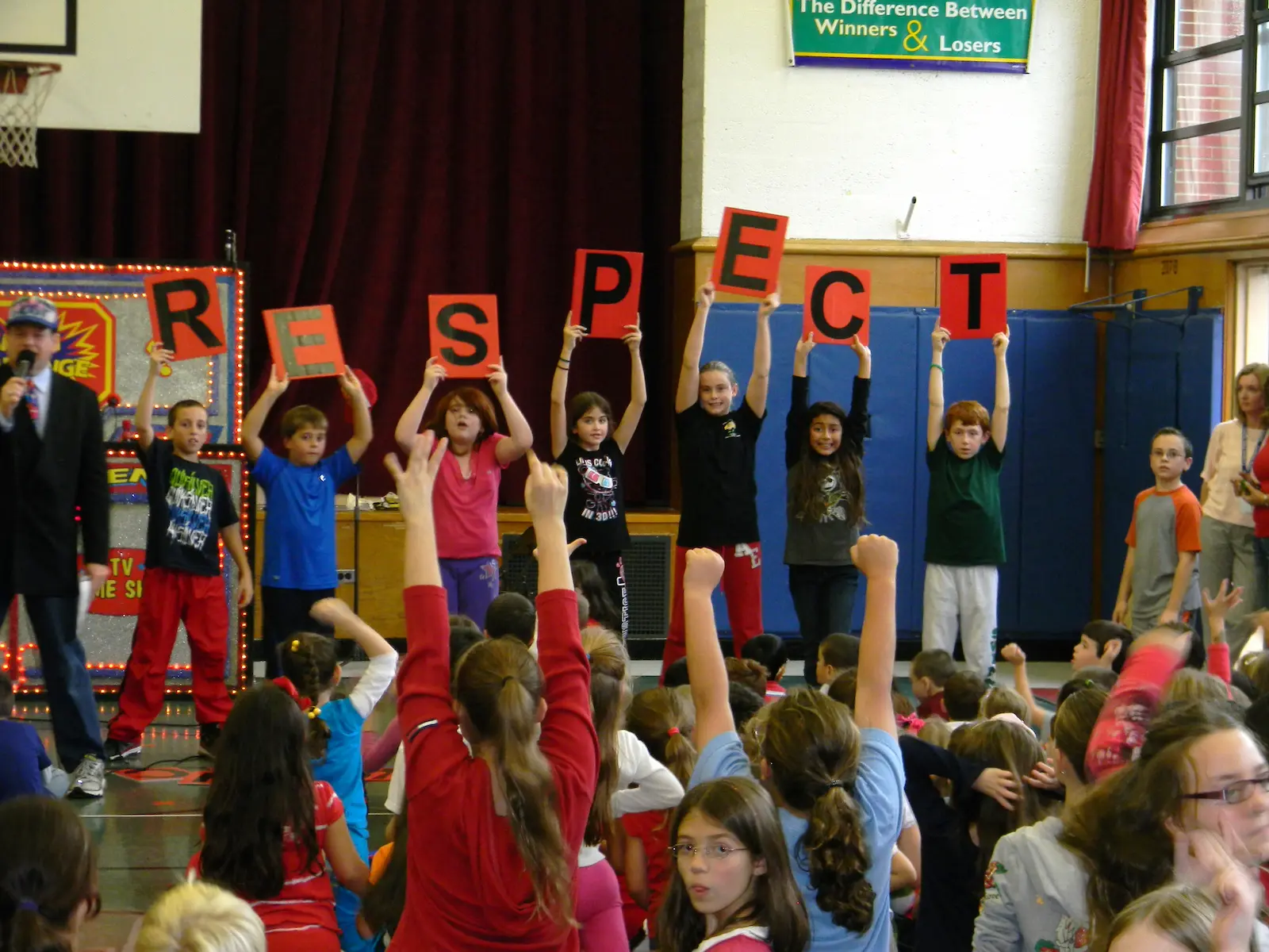 anti bullying assembly - kids holding letters spelling RESPECT